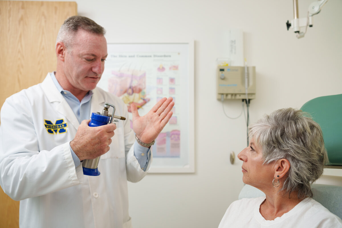 Dr. Stutz performing dermatology treatment